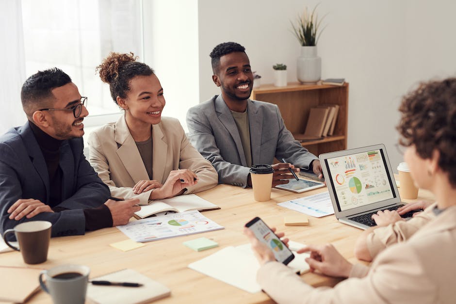 Image of diverse people in a workplace collaborating visually and professionally.