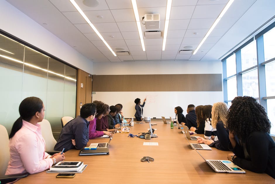 A group of purchasing managers discussing strategies in a conference room